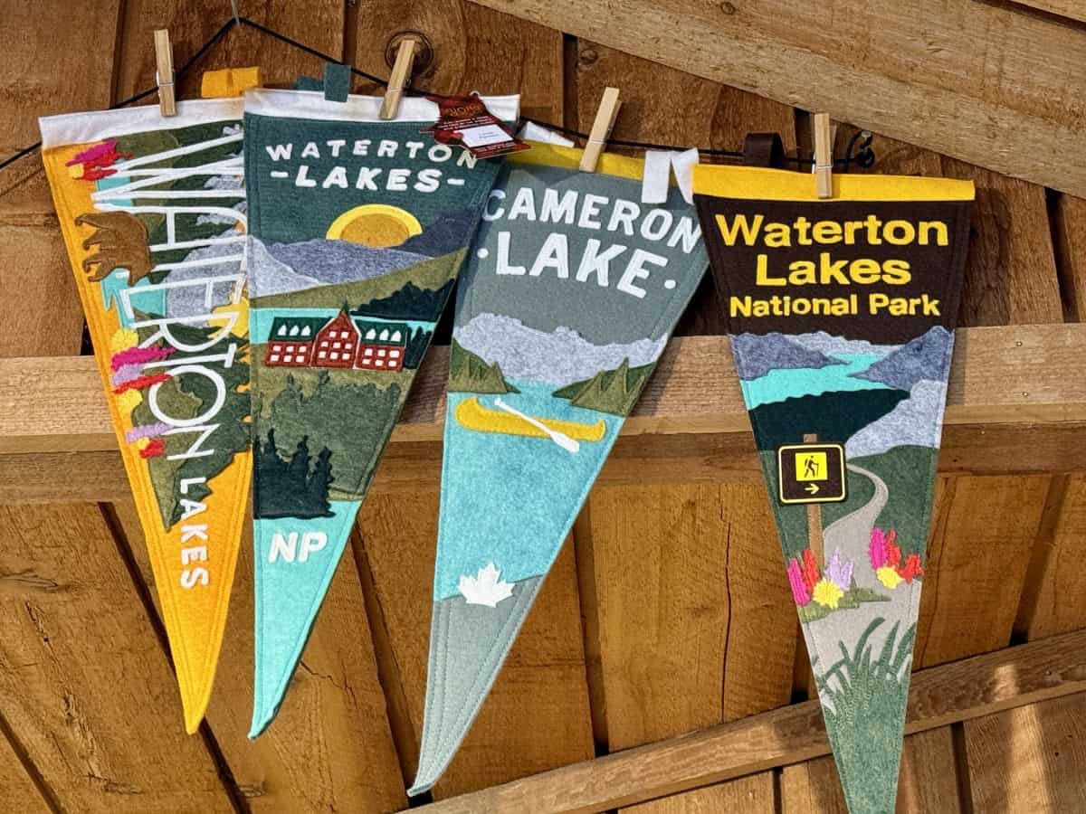 flags advertising Waterton Parks National Park in Alberta, Canada.