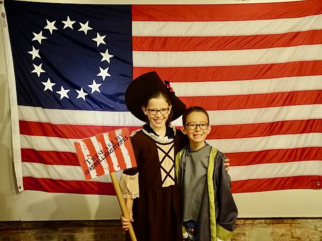 kids in front of American flag at Fraunces Tavern in NY