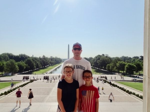 family standing in front of National Mall with Washington Monument in the background