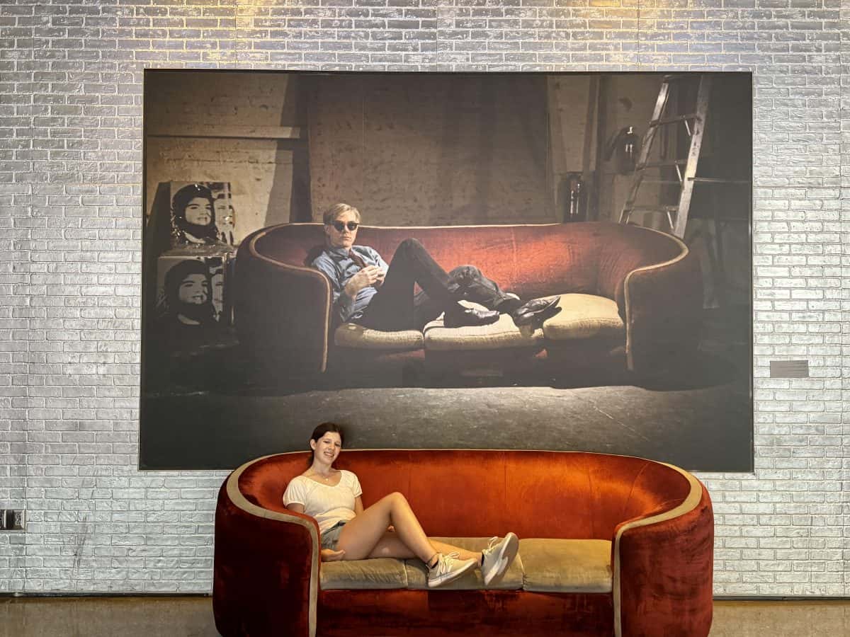 sitting on the couch at the Andy Warhol Museum in Pittsburgh, PA