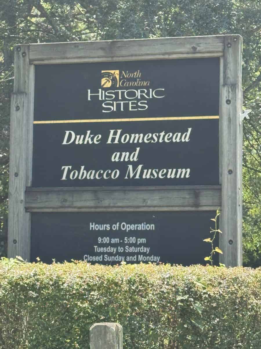 sign at the entrance to Duke Homestead State Historic Site in Durham North Carolina