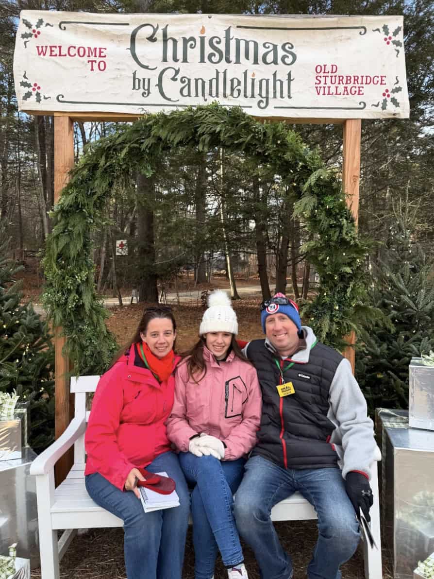 our family outside the sign at Christmas by Candlelight at Old Sturbridge Village in Sturbridge, MA
