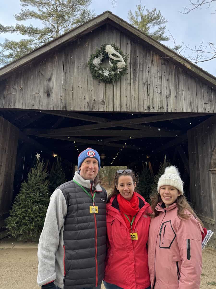 in front of the bridge or Wishes at Christmas by Candlelight at Old Sturbridge Village in Sturbridge, MA