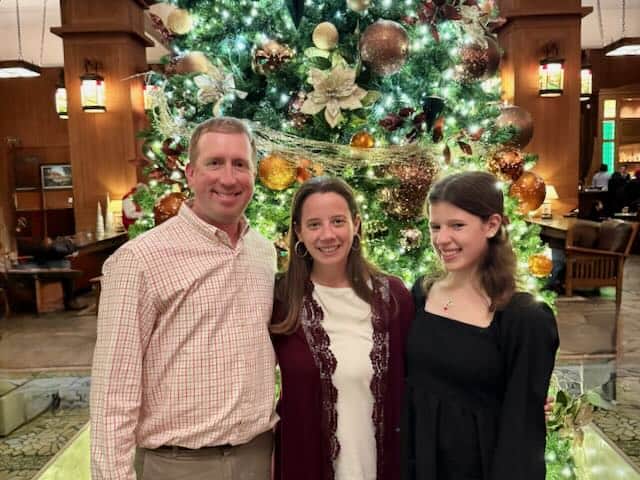 our family in front of Christmas tree at Omni Park Grove Inn