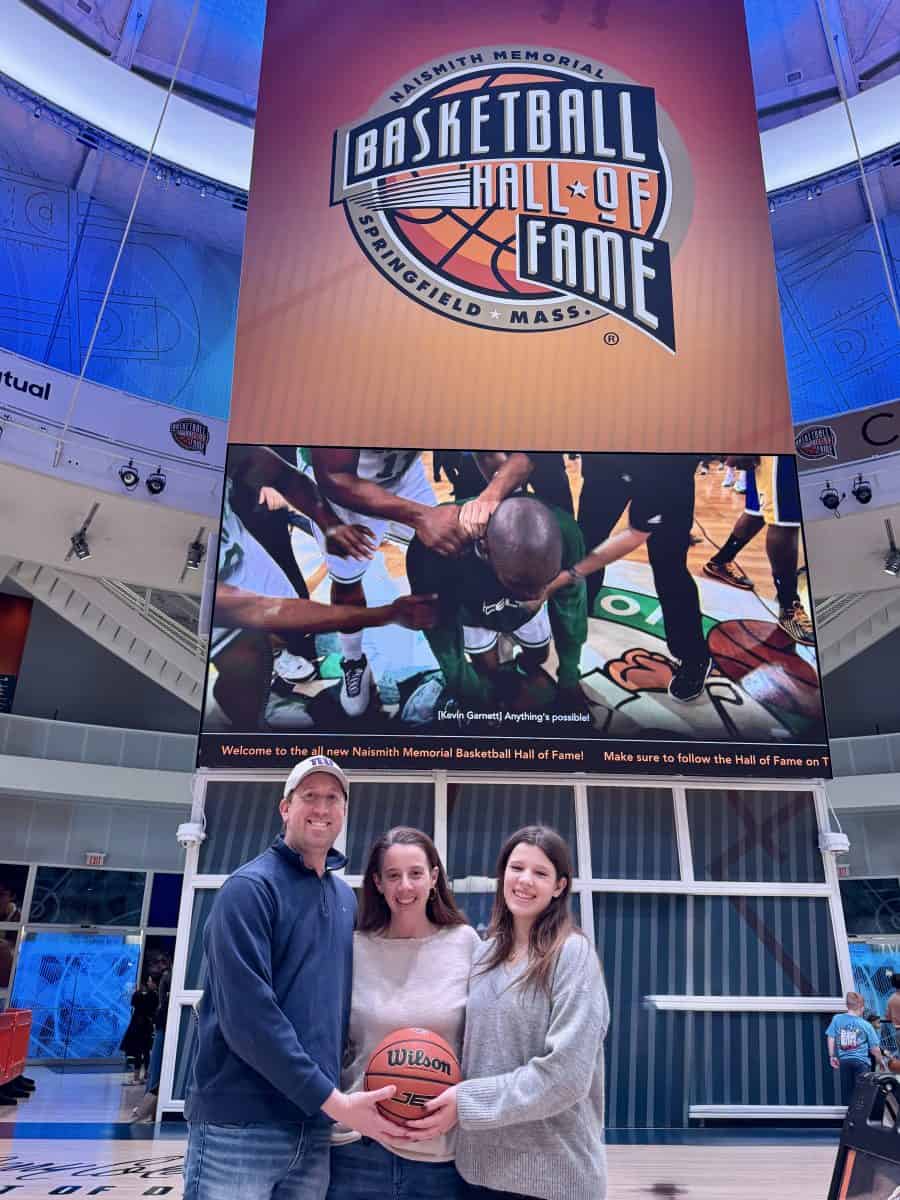 posing on the main court at the Basketball Hall of Fame in Springfield, MA