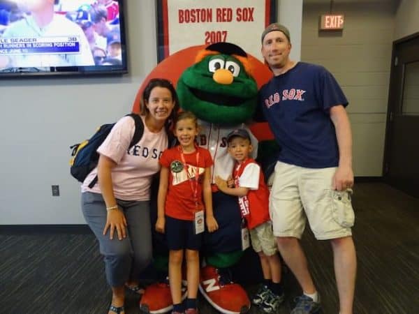 posing with Wally at a Red Sox game