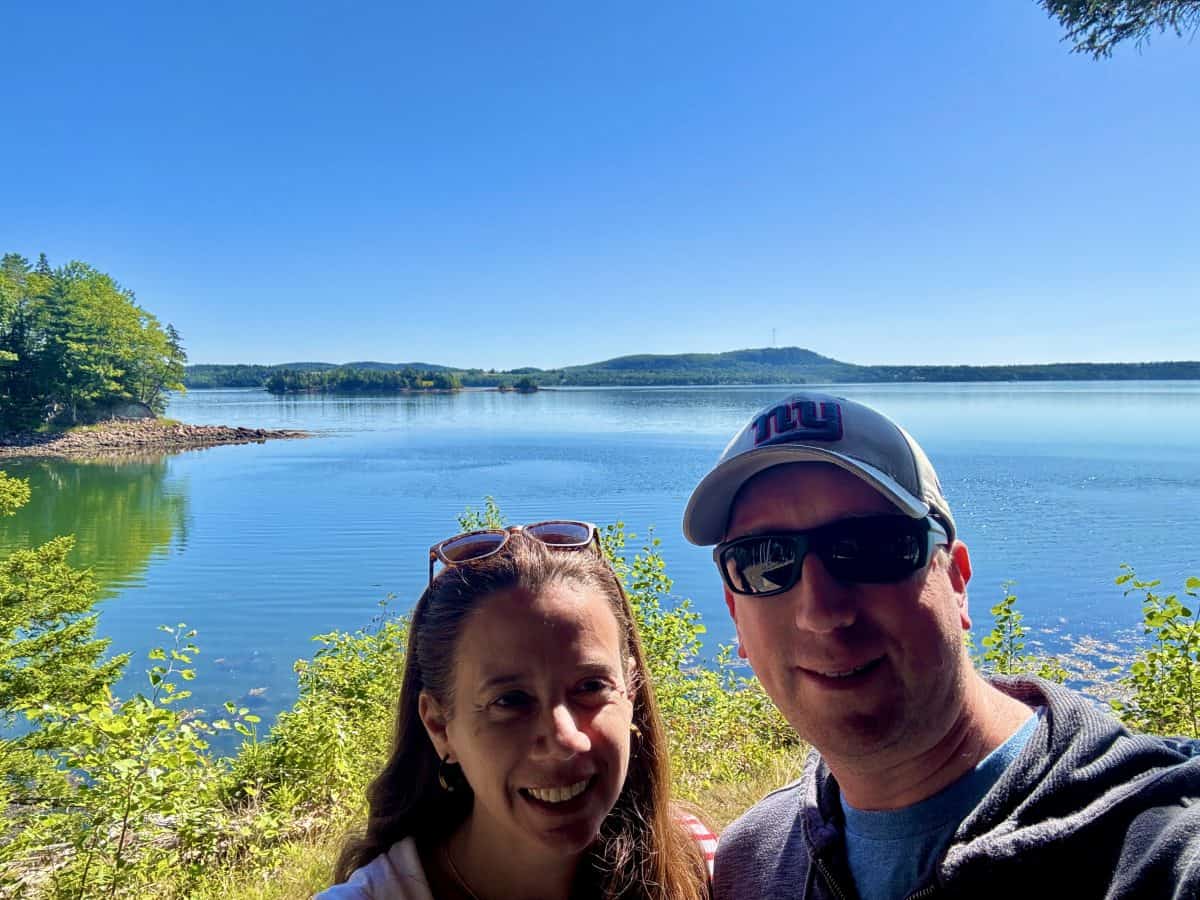 posing at the edge of the American side of the view of the Saint Croix International Historic Park in Canada and Maine, USA