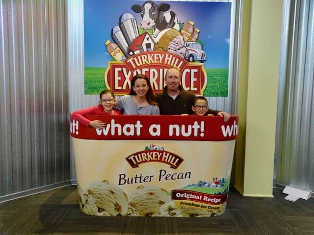 family inside pretend ice cream tub at Turkey Hill Experience in PA