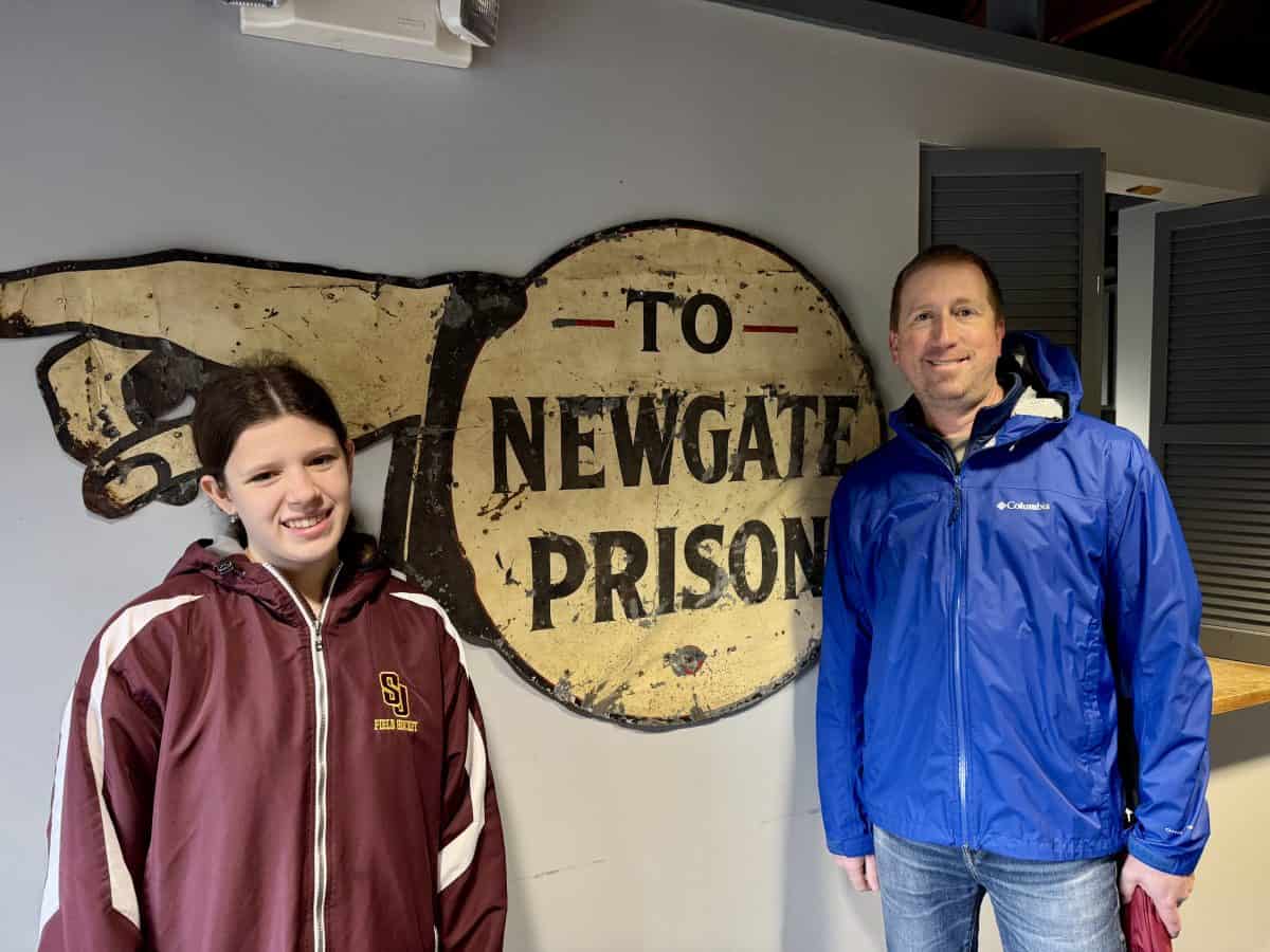 posing in front of the sign  at Old New-Gate Prison and Copper Mine in east Granby, CT