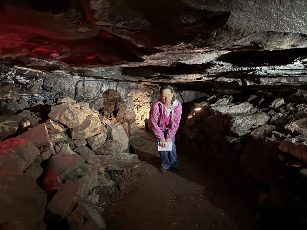 standing inside the cave at Old New-Gate Prison and Copper Mine in east Granby, CT