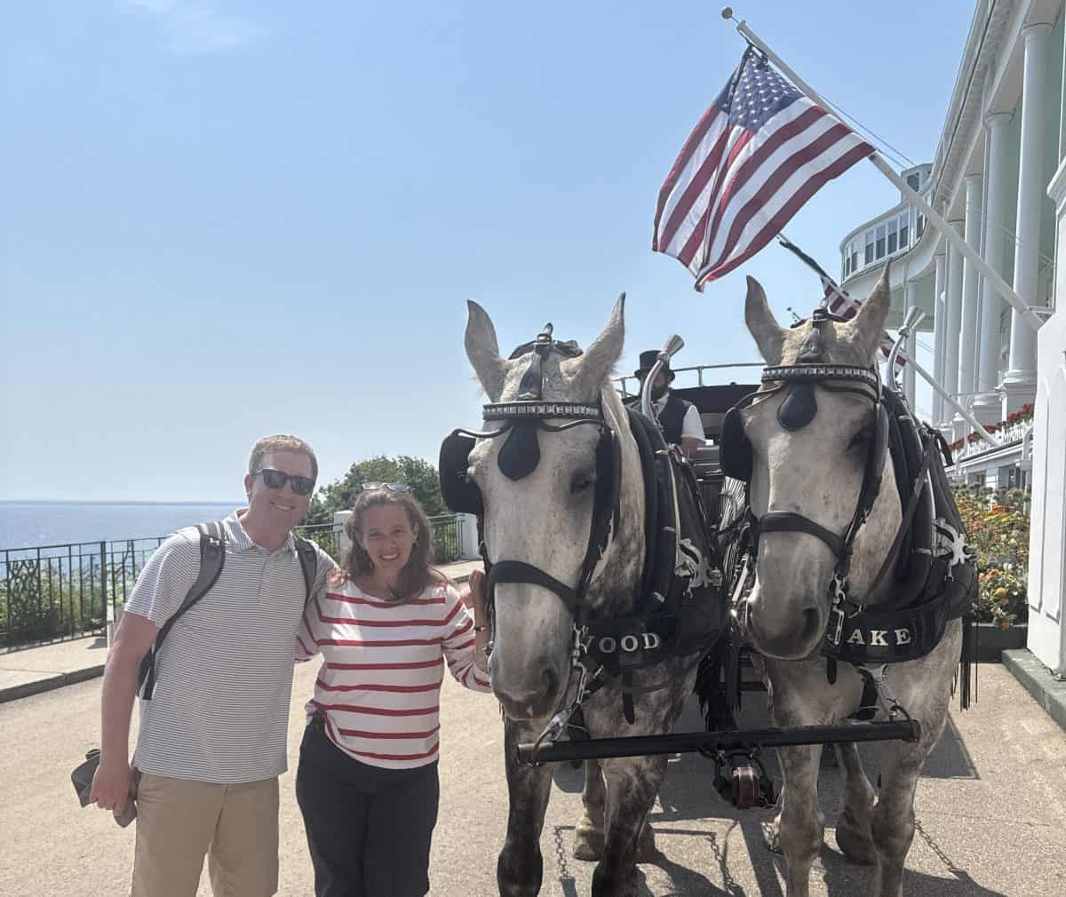 posing with horses and coachmen at the Grand Hotel on Mackinac Island