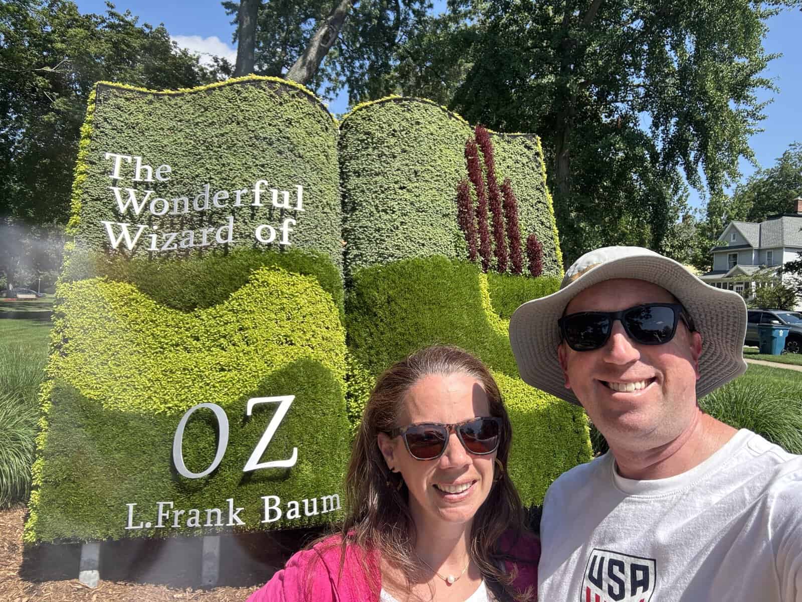 posing in Centennial Park in Holland, MI in front of the garden dedicated to the Wizard of Oz