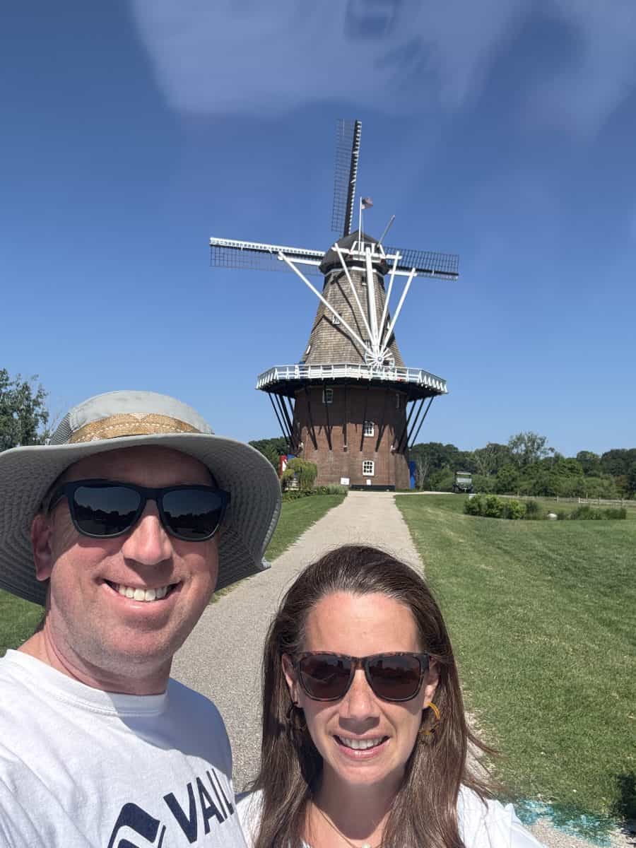posing by the windmill at Windmill Island Gardens in Holland, MI