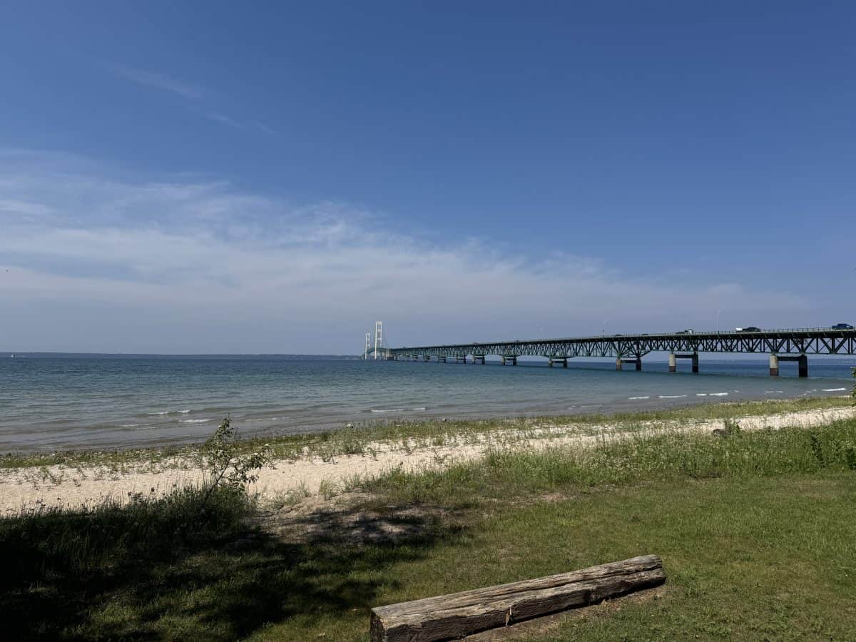 view of the Mighty Mac Bridge next to Colonial Michilimackinac in Mackinaw City Michigan