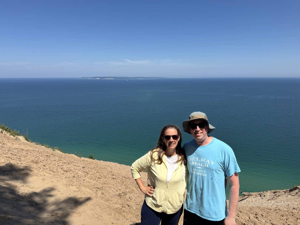 posing in front of Lake Michigan at Sleeping Bear Dunes National Lakeshore in Michigan